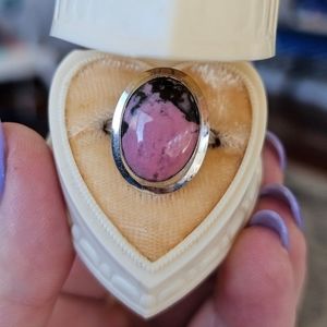 10k white gold rhodonite ring size 5 1/4. It measures between 5.5 and 5.25 on my